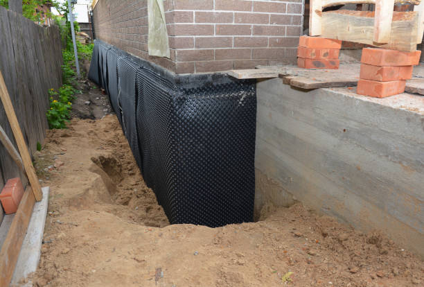 Happy homeowners after waterproofing job in Randallstown